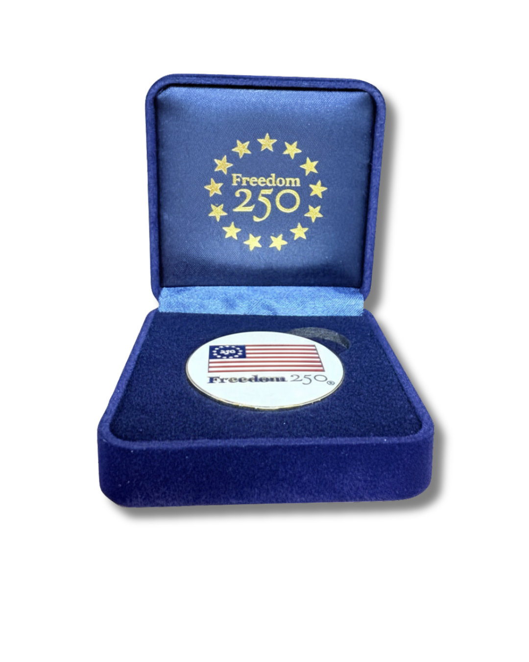 Medal with 'Freedom 250' design in a blue velvet box on a white background