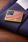 Lapel Pin with American flag design and 'Freedom 250' text on a purple fabric background