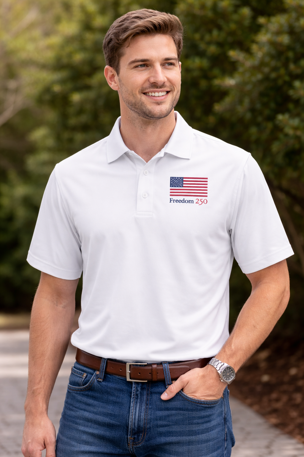 Man wearing a white polo shirt with an American flag logo outdoors