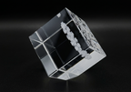 Crystal cube with intricate design on a black background