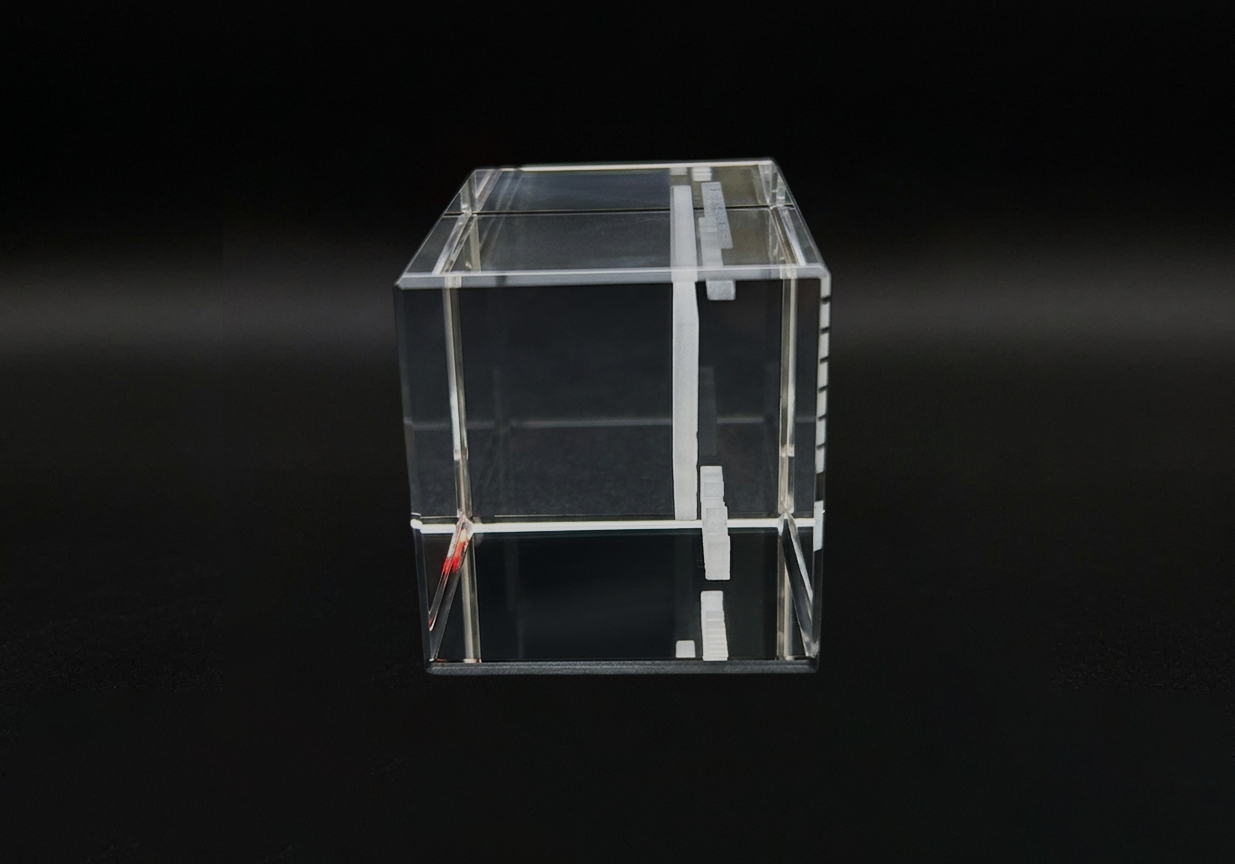 Clear acrylic cube on a black background