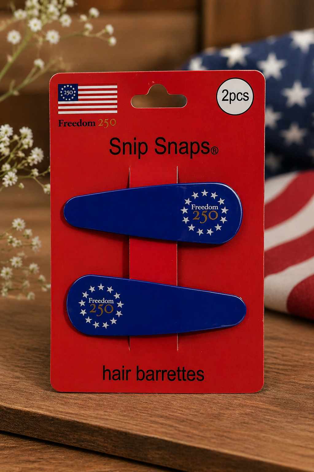 Red packaging of Snip Snaps hair barrettes with blue and white design on a wooden surface.